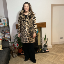 Load image into Gallery viewer, Women’s animal print faux fur coat with flattering fit, styled for elegant wear