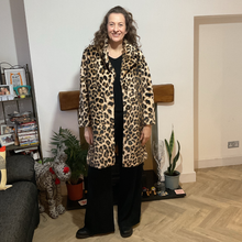 Load image into Gallery viewer, Women’s animal print faux fur coat with flattering fit, styled for elegant wear