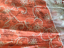 Load image into Gallery viewer, Orange with black flowers and embroidered white flowers with tassels