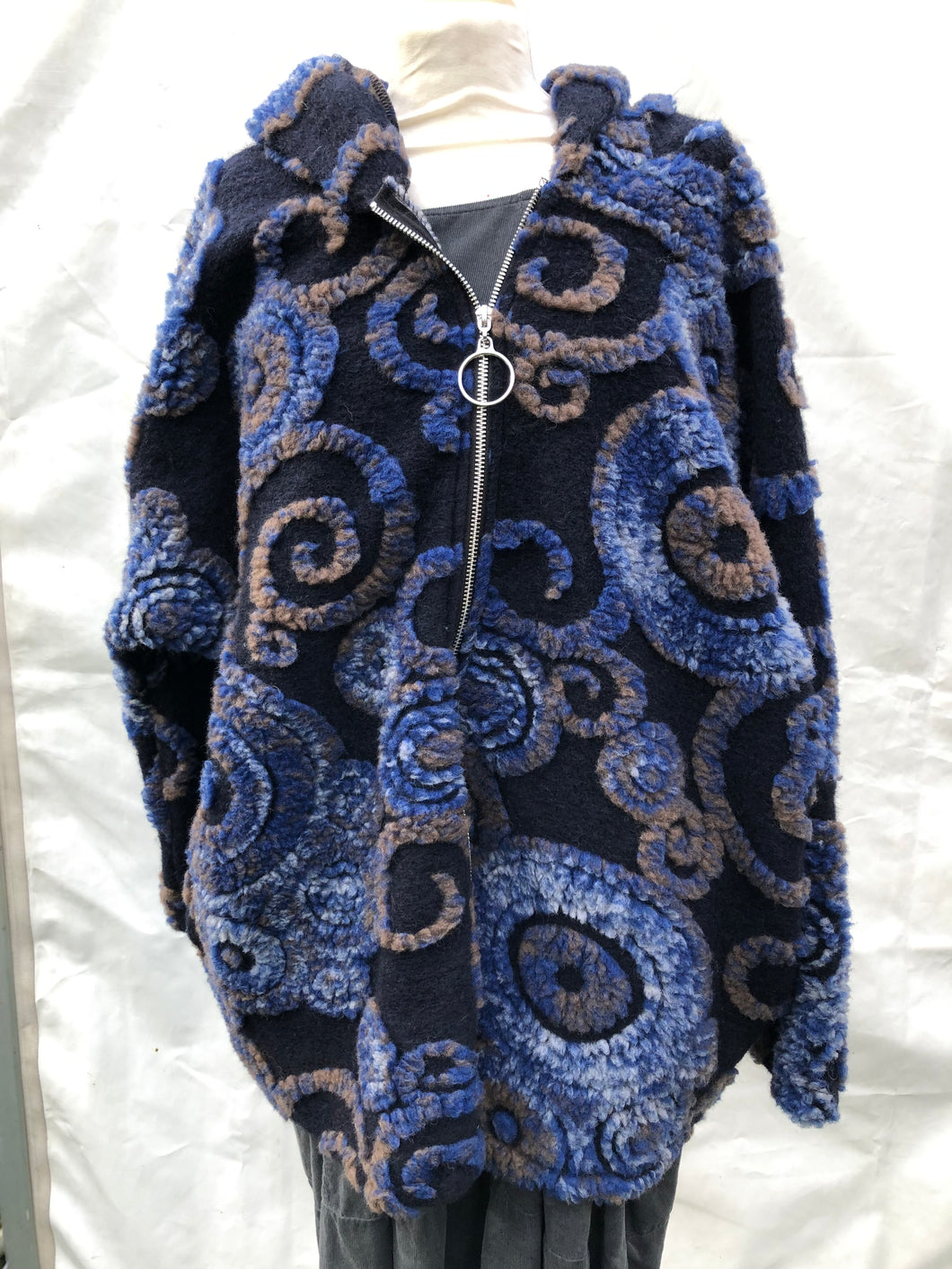 Black with royal blue, brown and white swirl design 100% wool coat
