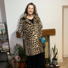 Load image into Gallery viewer, Women’s animal print faux fur coat with flattering fit, styled for elegant wear
