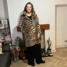 Load image into Gallery viewer, Women’s animal print faux fur coat with flattering fit, styled for elegant wear
