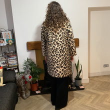 Load image into Gallery viewer, Women’s animal print faux fur coat with flattering fit, styled for elegant wear
